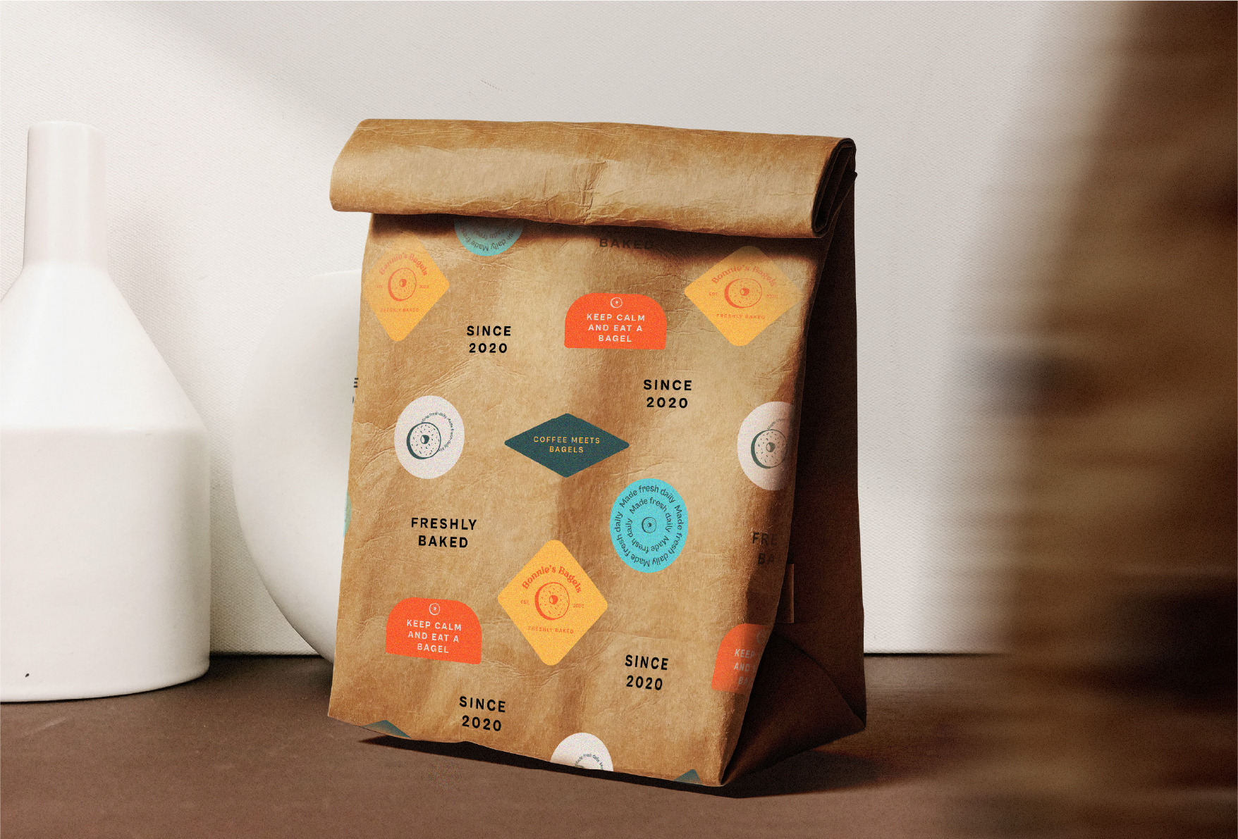 PACKAGING FOR THE DONUTS image of packaging for the donuts, with small stickers attached to the paper bag
