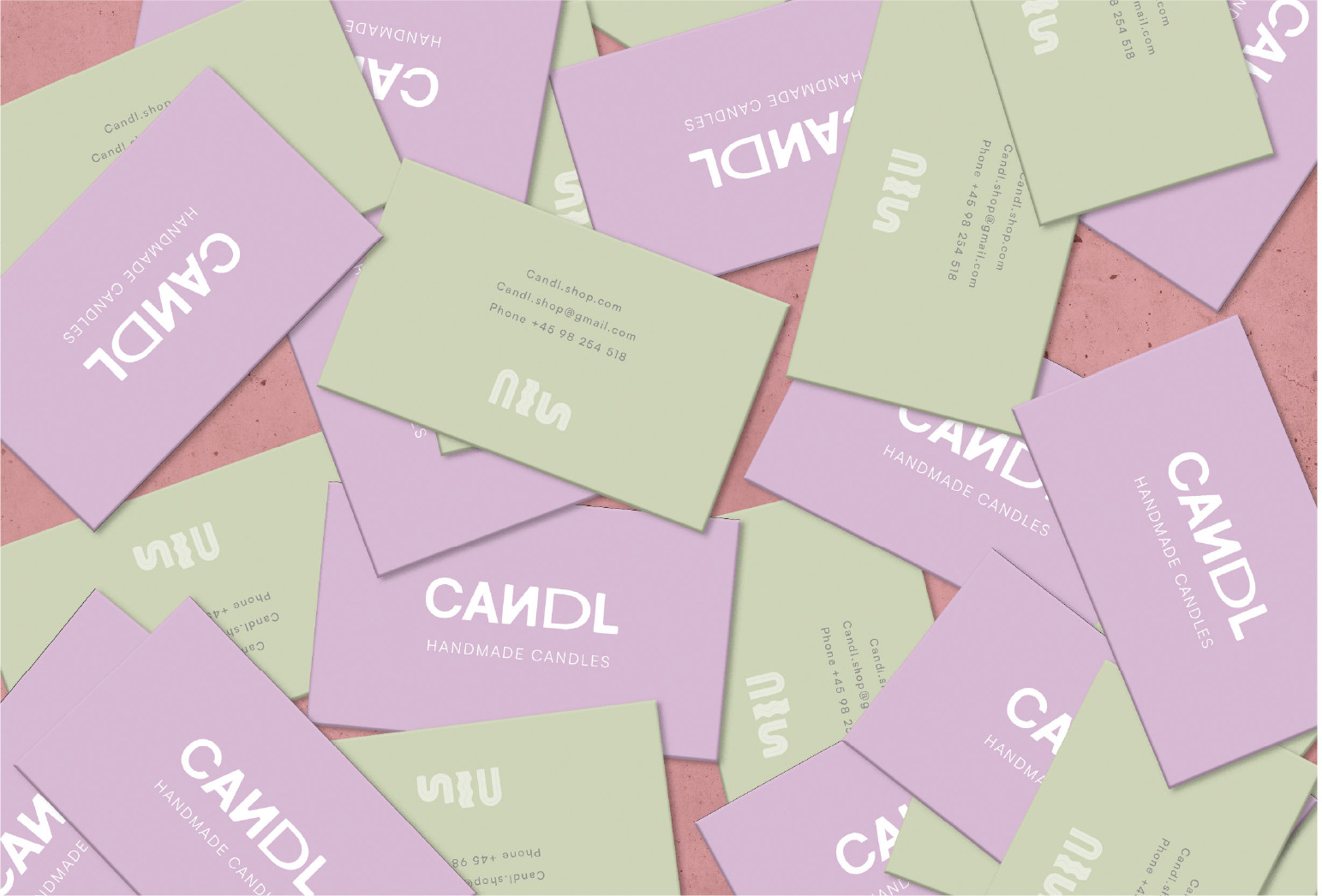 BUSINESS CARDS image of green and purple business cards with candl logo in the center