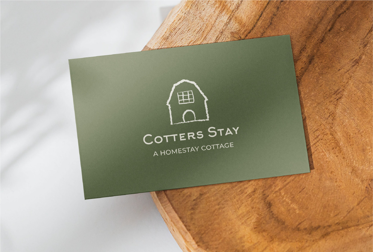 green card with Cotter Stay logo in the center